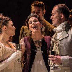 Three singers in performing in costume